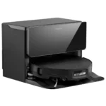 Glossy black Roborock robotic vacuum sitting on its charging/docking station.