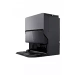 Modern black coffee machine with a front-loading brewer and extended drip tray, viewed from the side.