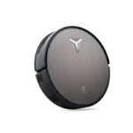 Round robotic vacuum with brushed metal top and a white Y logo at center