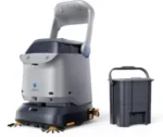 Autonomous floor-cleaning robot with a detachable waste bin attached nearby.