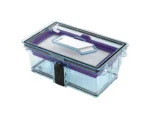 Transparent plastic lunch box with purple interior and a white removable tray inside, secured by a black latch.—Food container with airtight lid