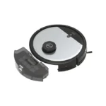 Round robotic vacuum with its detachable dirt bin removed and placed beside it.