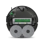 Bottom view of a robotic vacuum with two large foam side brushes and a central rolling brush assembly, ready for cleaning.