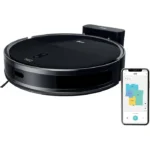 Black circular robotic vacuum with a docking station; a smartphone shows the floor-plan app for control and mapping.