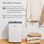 Bosch dehumidifier beside folded towels; conveys 16 L/day humidity removal at 38 dB and gentle drying.