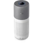 Tall Philips air purifier with gray top and white perforated body, circular blue-lit control on top for settings and airflow.”,”Philips cylindrical air purifier: gray upper housing, white perforated lower section, round digital control on the top.”,”Vertical air purifier by Philips in a two-tone gray and white finish, featuring a circular control panel on the top.