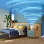 Modern bedroom with a bed, nightstands, and a white air purifier on the right table; swirling blue light on the wall above.
