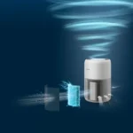 Philips air purifier emitting a stream of clean air with a glowing blue filter panel in front, set against a dark blue background.