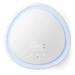 Round white smart diffuser with a blue ambient glow and touch control panel showing icons and digital readout, device for aroma diffusion and lighting.