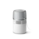 White portable humidifier with a translucent water tank and a power cord, emitting a cool mist