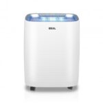 White portable air purifier with a blue-lit control panel on top, standing on a white background.