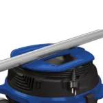 Shop vacuum with a metal wand resting across the top and a two-prong power plug hanging on the side.