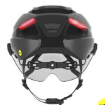 Rear view of a dark gray cycling helmet with integrated red LED tail lights and chin strap retention system.