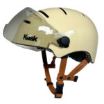 Beige Kask climbing helmet with clear visor and brown adjustable straps