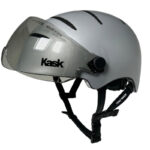 Gray cycling helmet with a clear, attached visor and adjustable chin strap (Kask brand)