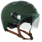 Green ski helmet with clear built-in visor and brown chin straps, shown from a side angle.