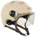 Cream-colored motorcycle helmet with clear visor and brown leather chin straps