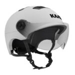 White open-face helmet with clear visor, adjustable strap, and black interior lining (KMI branding).