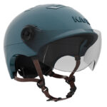 Teal open-face motorcycle helmet with a clear visor and brown leather chin straps
