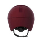 Maroon hard-shell ski helmet with an adjustable chin strap and buckle.