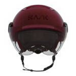Red KASK ski helmet with integrated clear visor and adjustable chin strap.