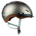 Side view of a metallic bronze Casco bike helmet with brown interior lining and gray chin strap