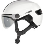 White ABUS motorcycle helmet with a clear visor, side view showing chin strap and branding