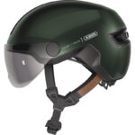 Dark green bike helmet with clear visor and adjustable chin strap, branded ABUS, for protective riding.