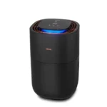Black Beurer compact air purifier with a blue indicator light on the top touch panel.