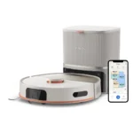 Philips robotic vacuum on its dock with a smartphone showing the cleaning app