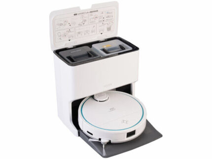White autonomous vacuum with a docking/charging station, lid open showing compartments, and the robot resting on the mat in front.