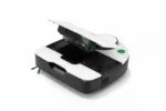 Compact automated laboratory instrument with an open lid and white/black housing, green accents, on a white background for sample processing.