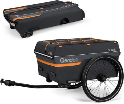 Bike cargo trailer with dark gray fabric, orange accents, and a large wheel, attached to a hitch.