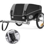 Bike trailer with a black/gray cover hitched to a frame, showing a rear wheel, suspension, and CXWXC logo for carrying cargo behind a bicycle.