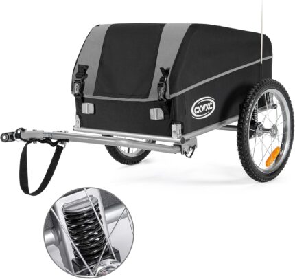Bike trailer with a black/gray cover hitched to a frame, showing a rear wheel, suspension, and CXWXC logo for carrying cargo behind a bicycle.