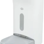 White automatic soap dispenser with a clear soap level window and a shallow gray tray at the base.