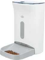 White automatic pet feeder with a removable bowl filled with dry kibble.