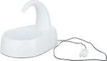 White electric device with a curved spout rising from a rounded base, connected to a power adapter via a cord.