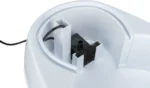 Close-up of the white appliance's interior, showing a foam filter and internal housing.