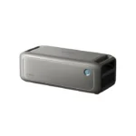 Portable rectangular Bluetooth speaker with a metallic front mesh and a blue-ringed power button on the side.