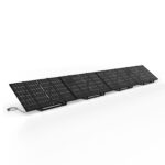 Row of tilted black solar panels on metal frames, connected by a trailing power cable against a white background.