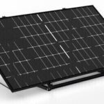Solar solar panel mounted on a stand with a cable attached, angled for sun exposure and energy generation.