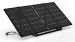 Solar solar panel mounted on a stand with a cable attached, angled for sun exposure and energy generation.