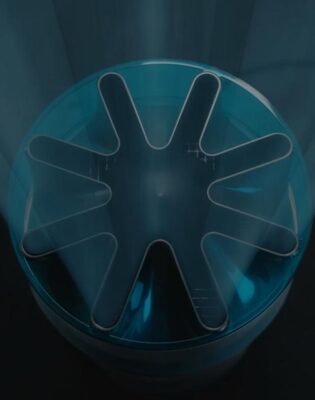 Top-down view of a blue circular container with a dark eight-point star-shaped insert inside.
