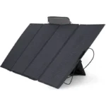 Portable folding solar panel charger with an adjustable kickstand, angled to capture sunlight for charging devices