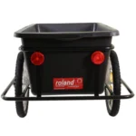 Rear view of a black utility wagon with a rectangular tub, red taillights, and metal frame wheels; Roland brand label visible on the side.