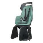 Green child bike seat with five‑point harness and foot straps mounted on a rear rack, ready for biking.