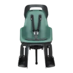 Green rear-mounted child bike seat with black 5-point harness and footrests.