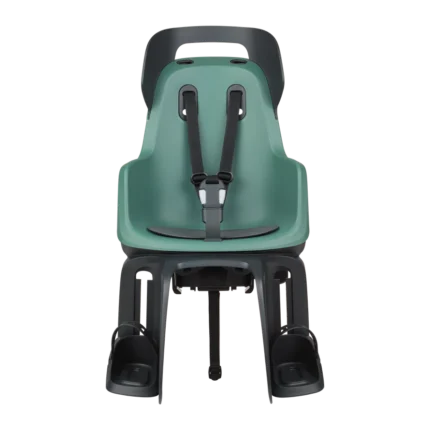 Green rear-mounted child bike seat with black 5-point harness and footrests.