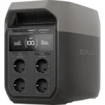 EcoFlow portable power station with four outlet sockets and USB ports; LCD shows 100% charge with input/output readings.